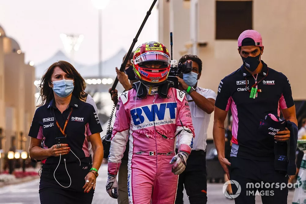 Sergio Perez, Racing Point, walks back after retiring
