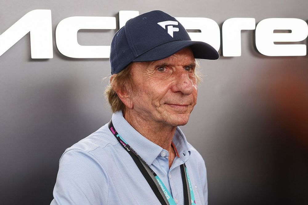 Emerson Fittipaldi looks on in the NEOM McLaren Formula E Team garage
