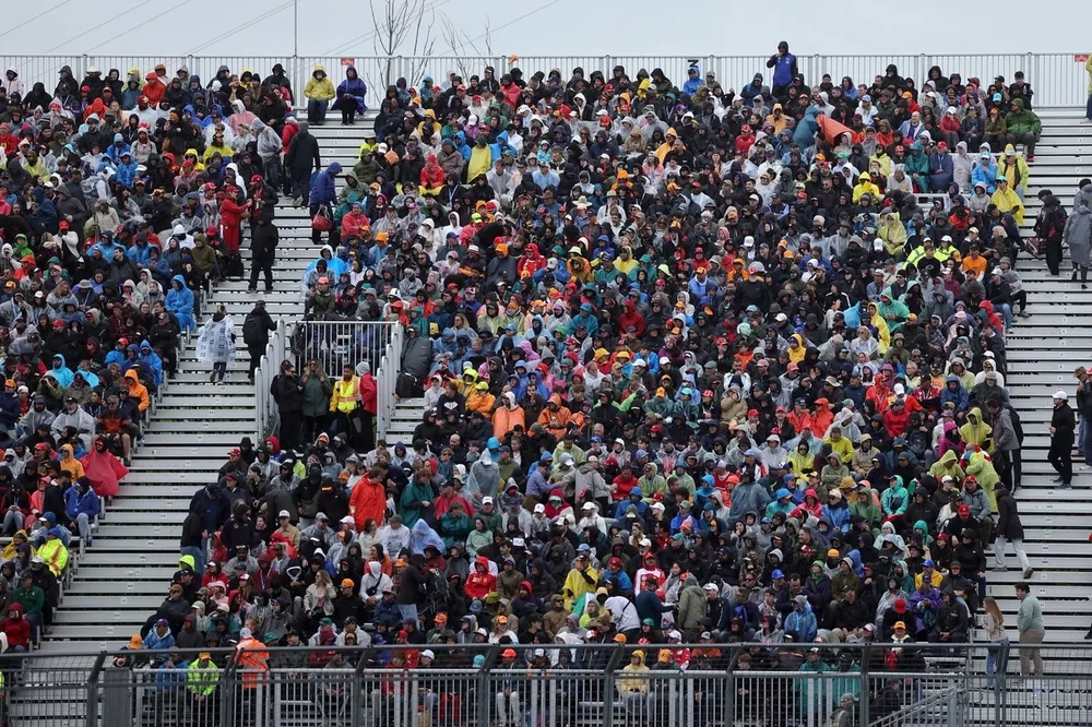 Fans fill a grandstand.