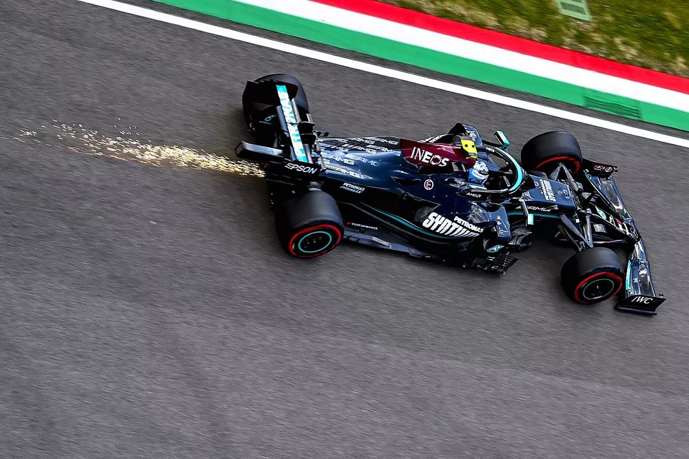 Sparks trail behind Valtteri Bottas, Mercedes W12