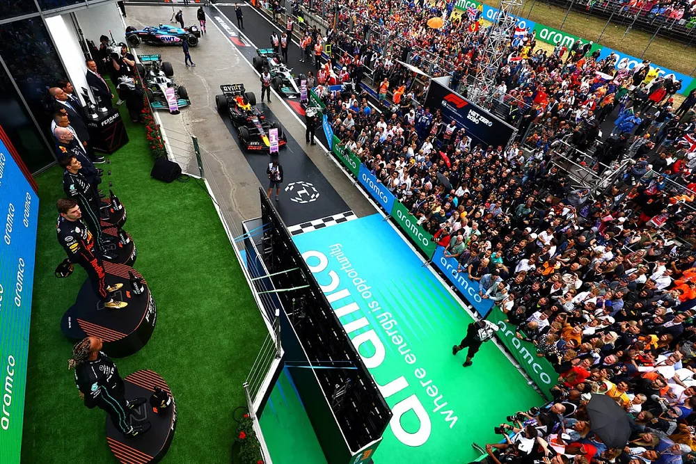 Lewis Hamilton, Mercedes-AMG, 2nd position, Max Verstappen, Red Bull Racing, 1st position, Adrian Newey, Chief Technology Officer, Red Bull Racing, George Russell, Mercedes-AMG, 3rd position, on the podium