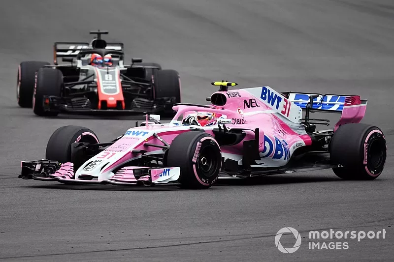 Esteban Ocon, Racing Point Force India VJM11 and Romain Grosjean, Haas F1 Team VF-18 