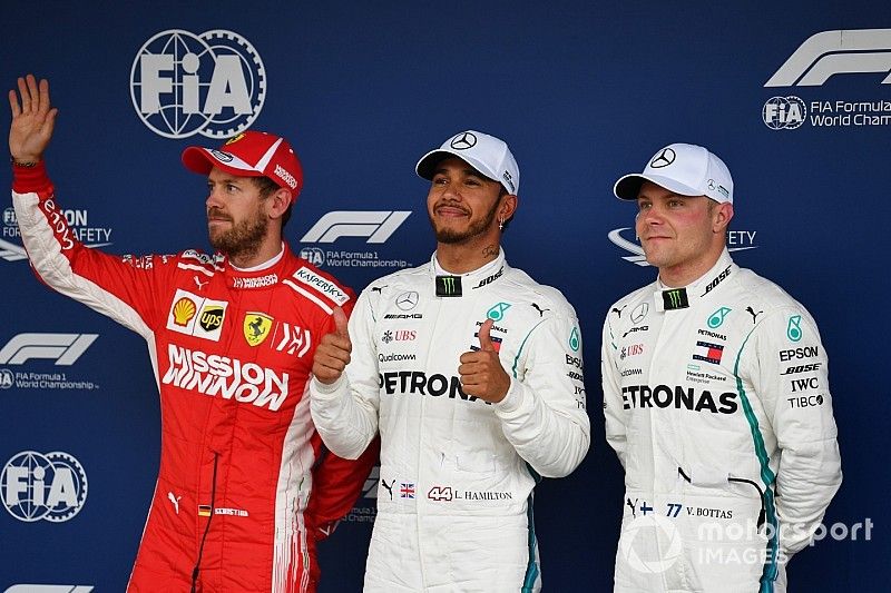 (L to R): Sebastian Vettel, Ferrari, Lewis Hamilton, Mercedes AMG F1 and Valtteri Bottas, Mercedes AMG F1 celebrate in Parc Ferme 