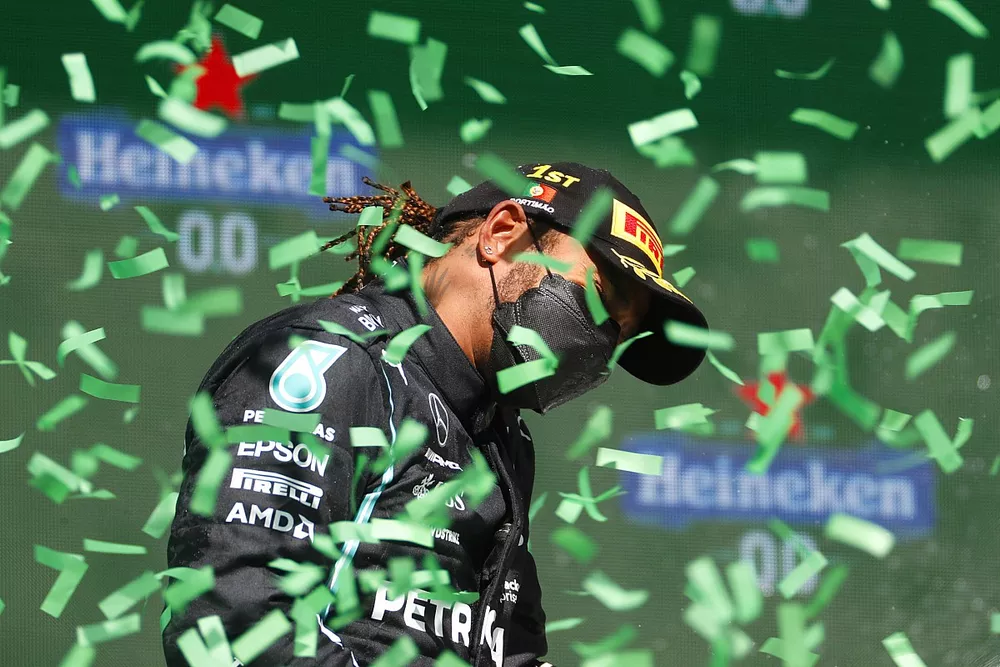 Lewis Hamilton, Mercedes, 1st position, celebrates on the podium as confetti falls