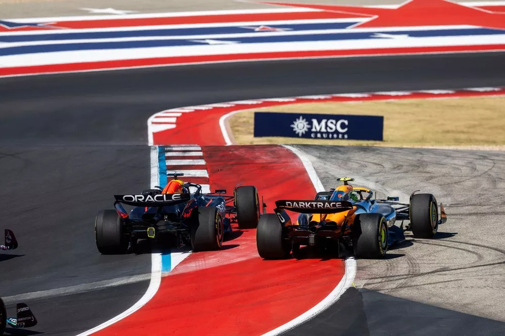 Max Verstappen, Red Bull Racing RB20, battles with Lando Norris, McLaren MCL38