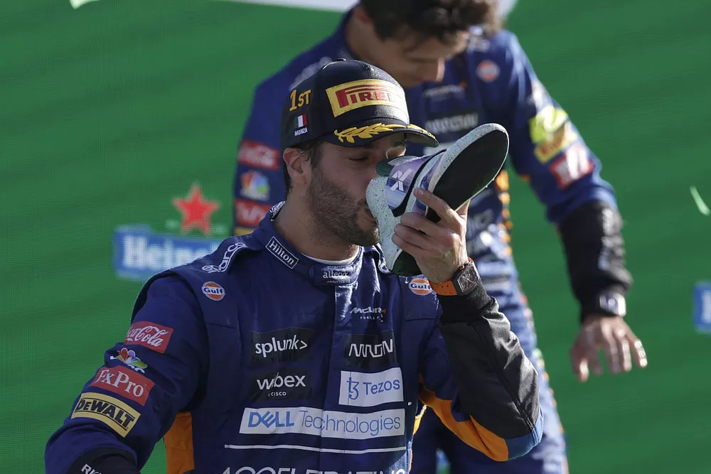 Daniel Ricciardo, McLaren, 1st position, performs a shoey on the podium