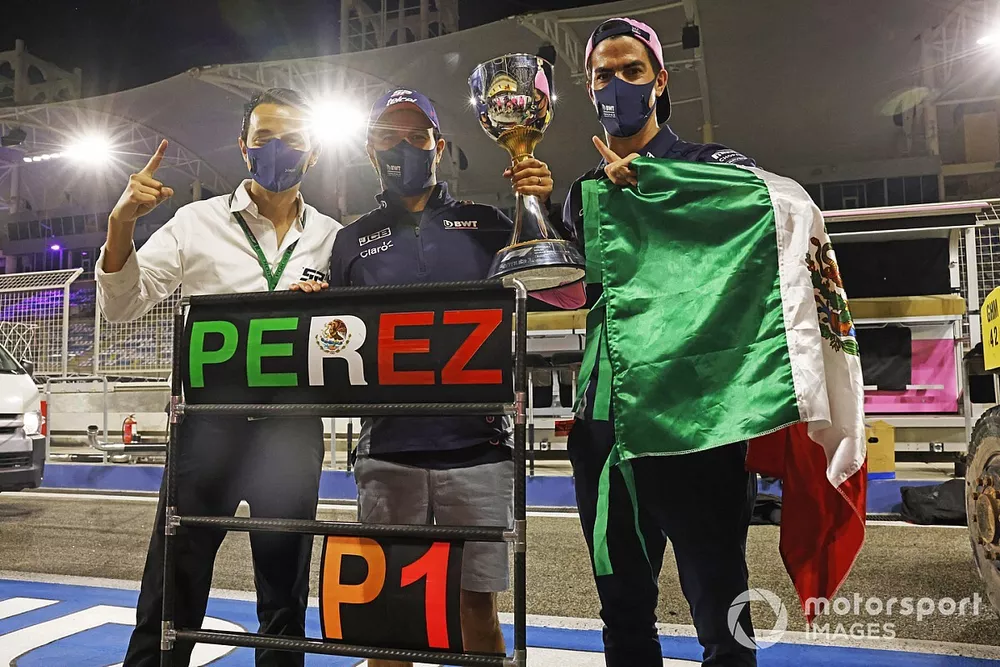 Sergio Perez, Racing Point, 1st position, celebrates victory with his team after the race