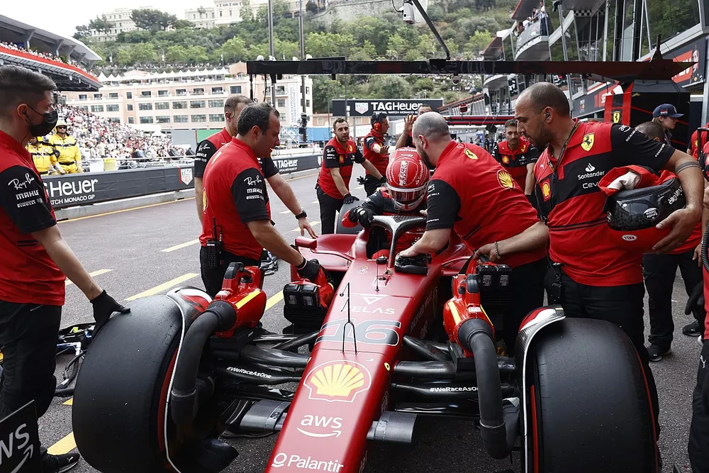 Pole man Charles Leclerc, Ferrari F1-75, climbs out of his car in the pit lane