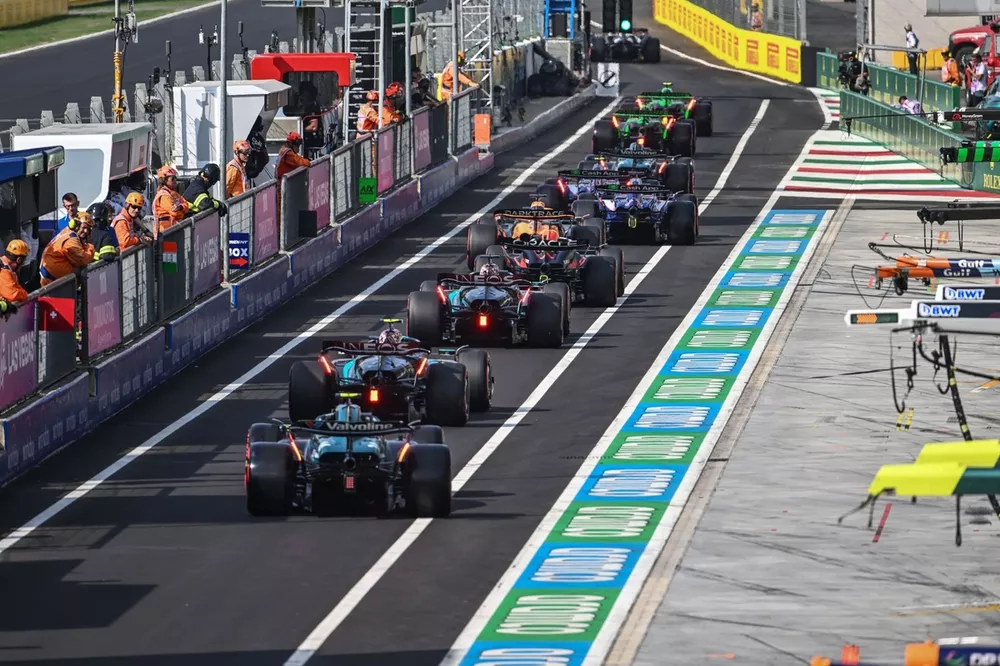Fernando Alonso, Aston Martin AMR24, Lewis Hamilton, Mercedes F1 W15, George Russell, Mercedes F1 W15, Max Verstappen, Red Bull Racing RB20, Oscar Piastri, McLaren MCL38, queue at the pit lane exit