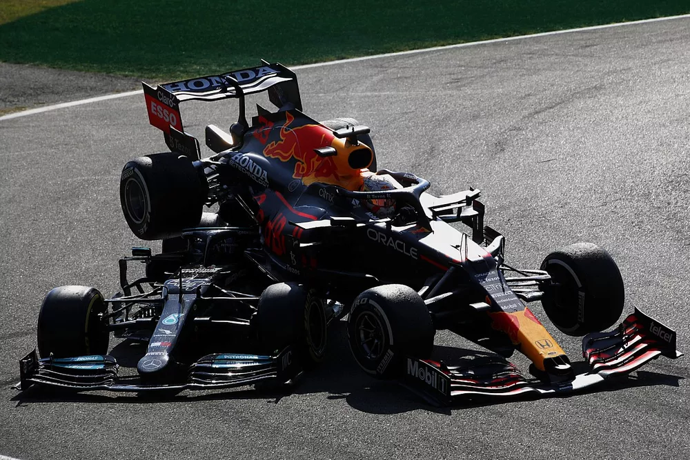 Lewis Hamilton, Mercedes W12, and Max Verstappen, Red Bull Racing RB16B, crash out of the race
