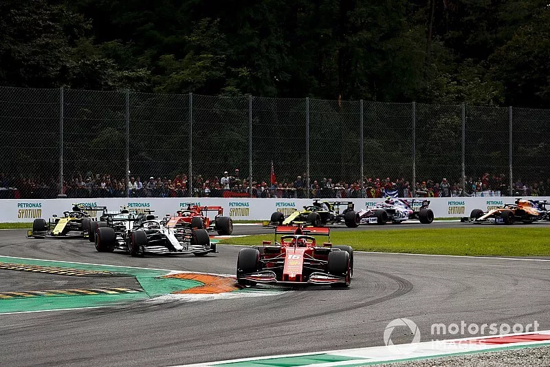 Charles Leclerc, Ferrari SF90, leads Lewis Hamilton, Mercedes AMG F1 W10, Valtteri Bottas, Mercedes AMG W10, Sebastian Vettel, Ferrari SF90, and the rest of the field at the start