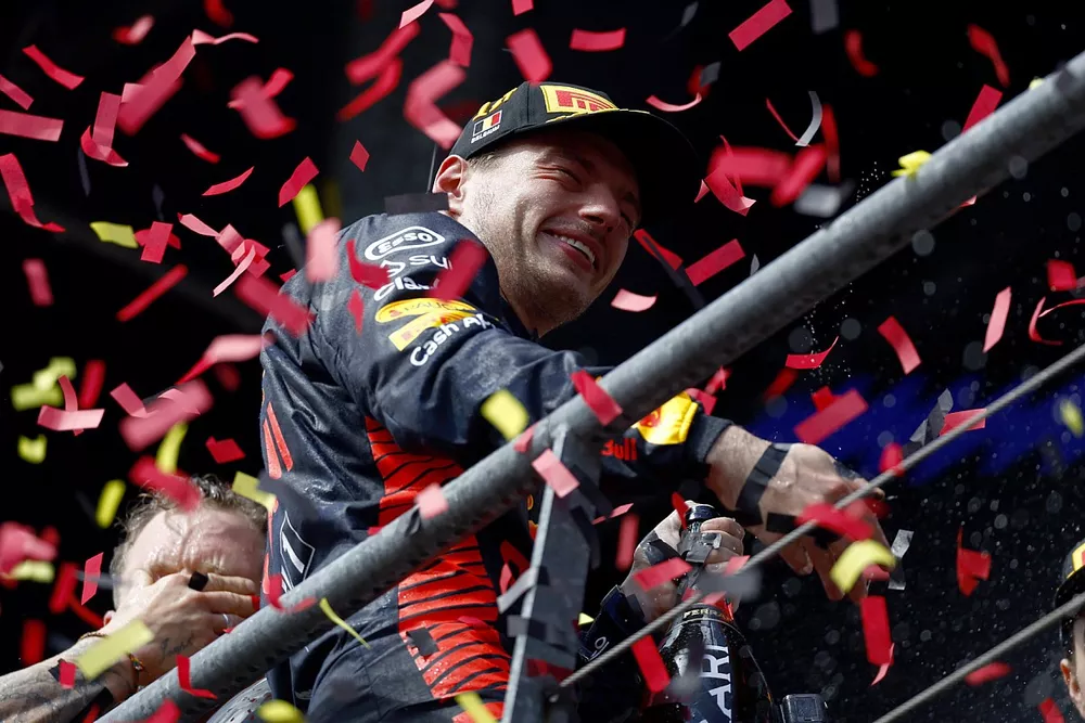Max Verstappen, Red Bull Racing, 1st position, celebrates on the podium with Champagne