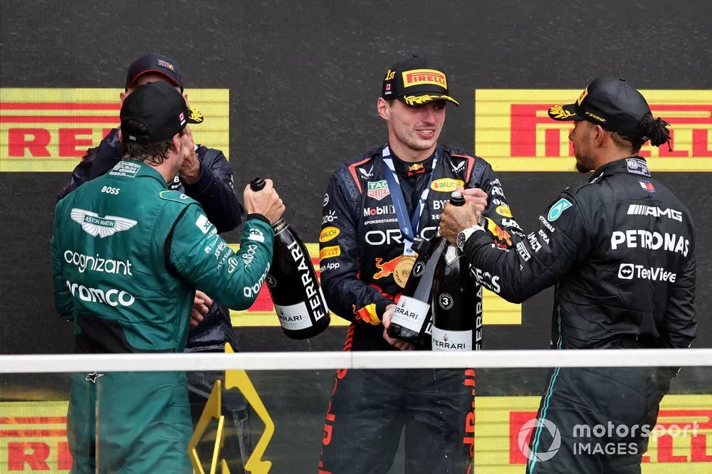 Fernando Alonso, Aston Martin F1 Team, 2nd position, Adrian Newey, Chief Technology Officer, Red Bull Racing, Max Verstappen, Red Bull Racing, 1st position, Lewis Hamilton, Mercedes-AMG, 3rd position, celebrate on the podium
