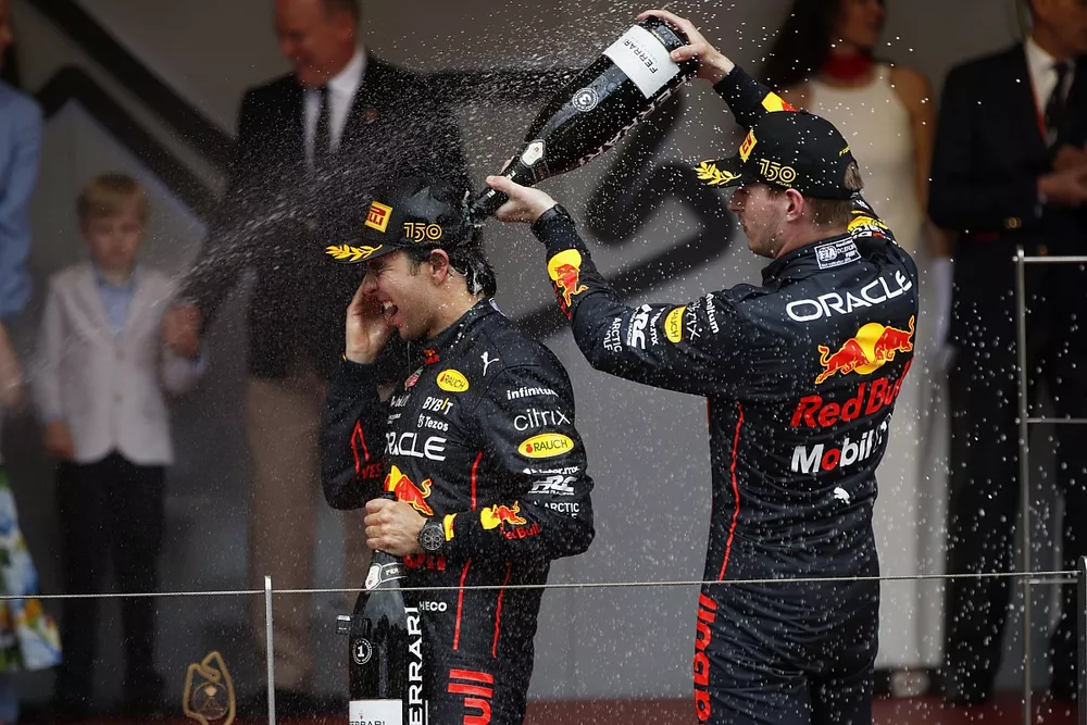 Max Verstappen, Red Bull Racing, 3rd position, pours Champagne over Sergio Perez, Red Bull Racing, 1st position, on the podium