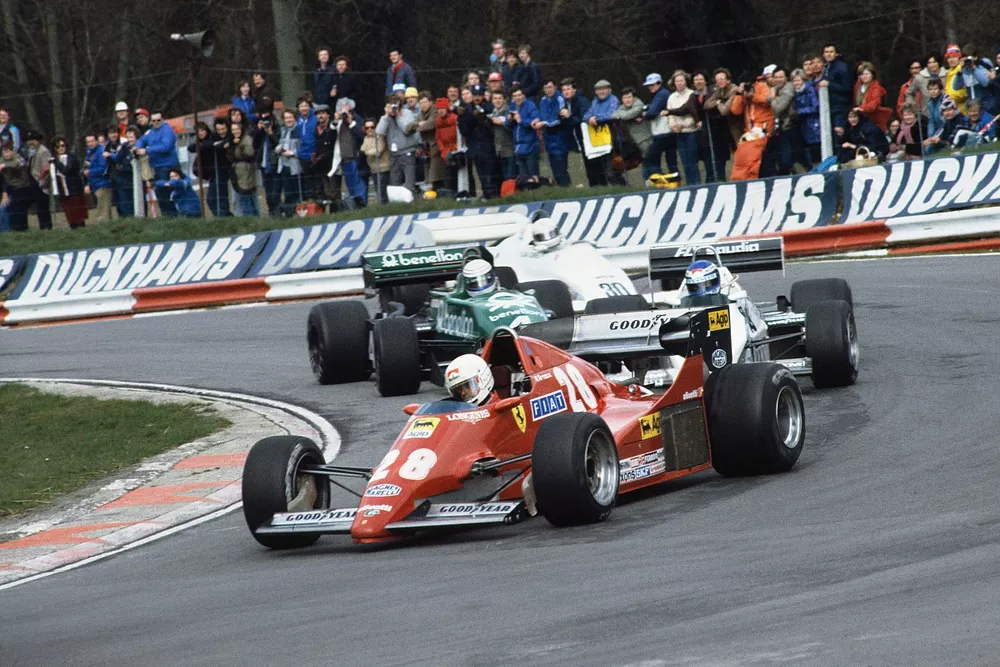 Rene Arnoux (Ferrari 126C2B), retired, leads Keke Rosberg (Williams FW08C-Cosworth), 1st position, Danny Sullivan (Tyrrell 011-Cosworth), 2nd position and Alan Jones (Arrows A6-Cosworth), 3rd position, action. 