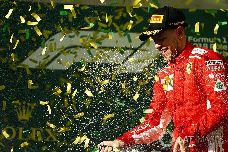 Sebastian Vettel, Ferrari, celebrates victory on the podium