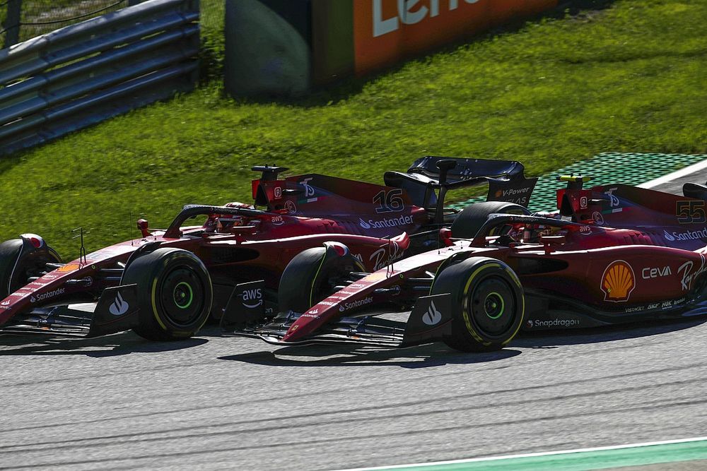 Charles Leclerc, Ferrari F1-75, battles with Carlos Sainz, Ferrari F1-75