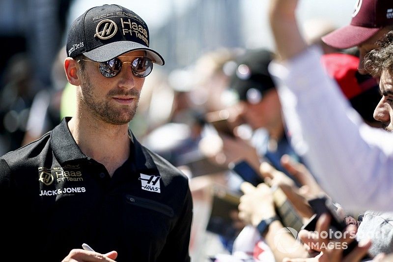 Romain Grosjean, Haas F1 signs a autograph for a fan 