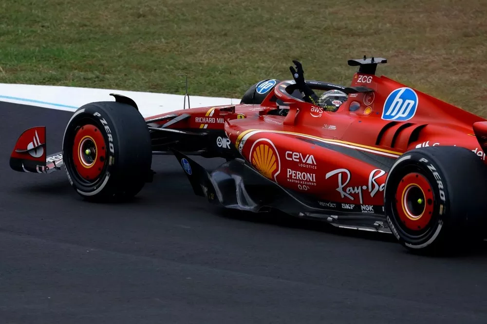 Charles Leclerc, Ferrari SF-24, 1st position, waves to fans on his slow down lap