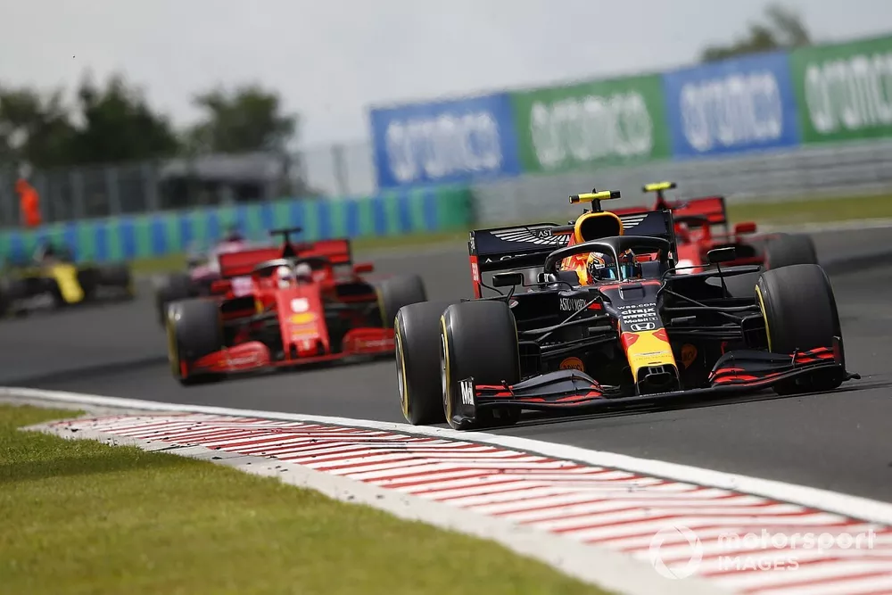 Alex Albon, Red Bull Racing RB16, leads Charles Leclerc, Ferrari SF1000 and Sebastian Vettel, Ferrari SF1000 
