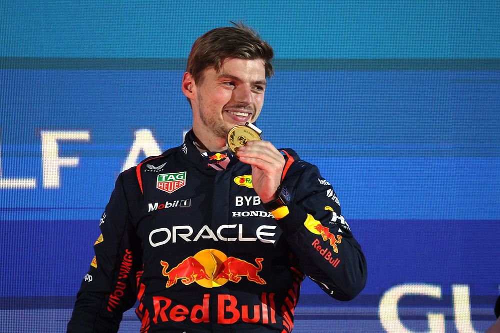 Max Verstappen, Red Bull Racing, 1st position, with his medal on the podium