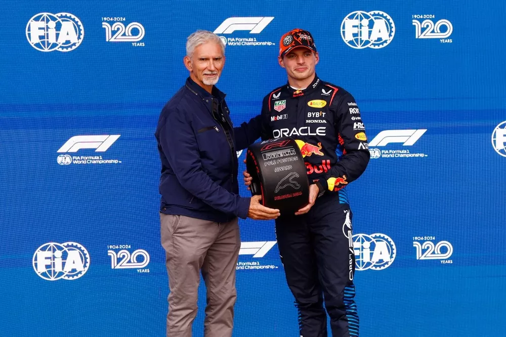 Max Verstappen, Red Bull Racing, receives his Pirelli Pole Position award from 1996 F1 world champion Damon Hill