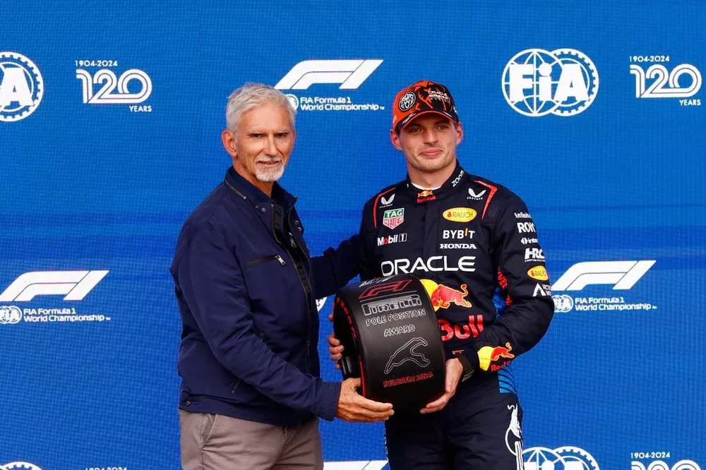 Max Verstappen, Red Bull Racing, receives his Pirelli Pole Position award from 1996 F1 world champion Damon Hill