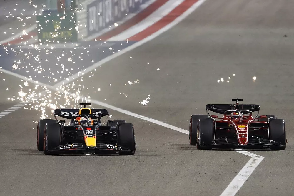 Sparks fly as Max Verstappen, Red Bull Racing RB18, battles with Charles Leclerc, Ferrari F1-75