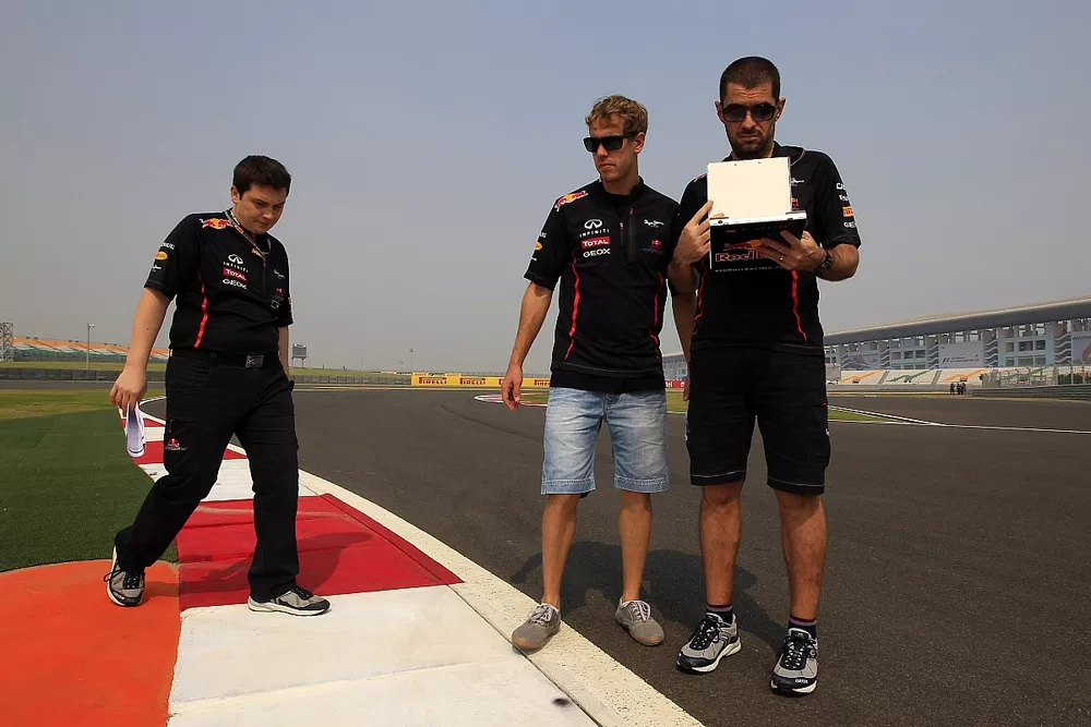 Sebastian Vettel, Red Bull Racing inspects the track with his race engineers