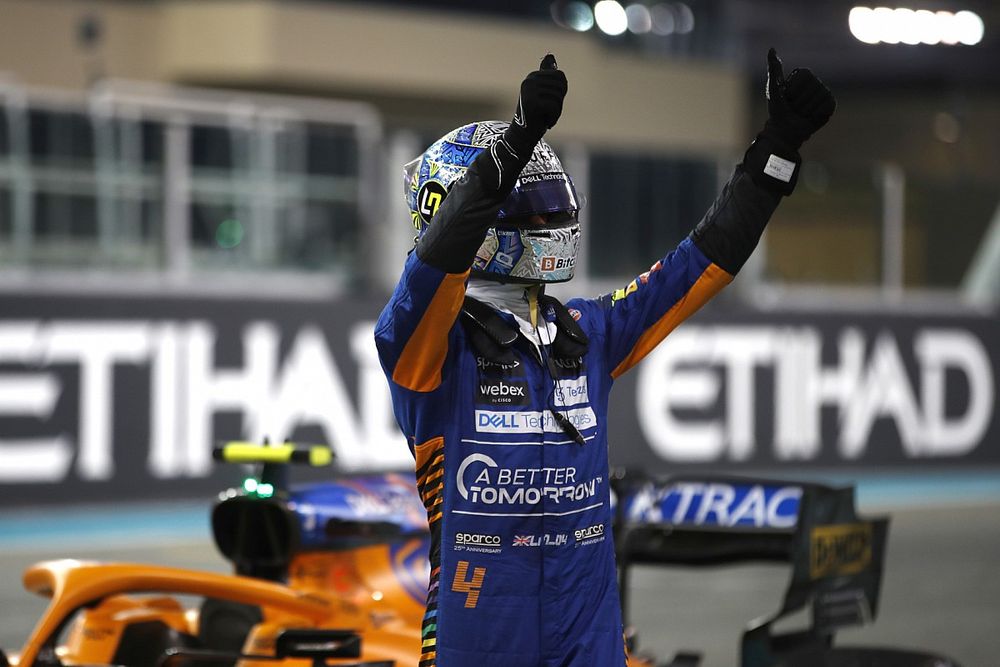 Lando Norris, McLaren, waves to fans after securing third on the grid