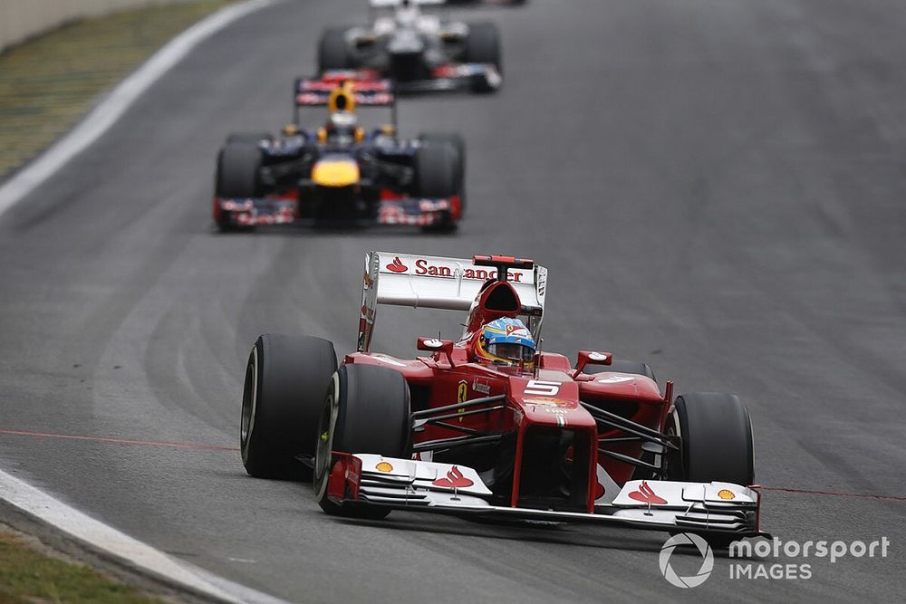 Fernando Alonso, Ferrari F2012, leads Sebastian Vettel, Red Bull RB8 Renault