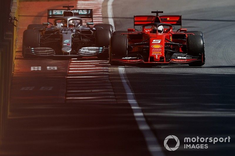 Sebastian Vettel, Ferrari SF90 and Lewis Hamilton, Mercedes AMG F1 W10 battle 