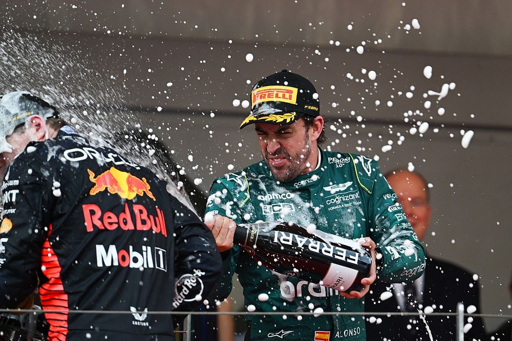 Fernando Alonso, Aston Martin F1 Team, 2nd position, sprays Max Verstappen, Red Bull Racing, 1st position, with Champagne on the podium
