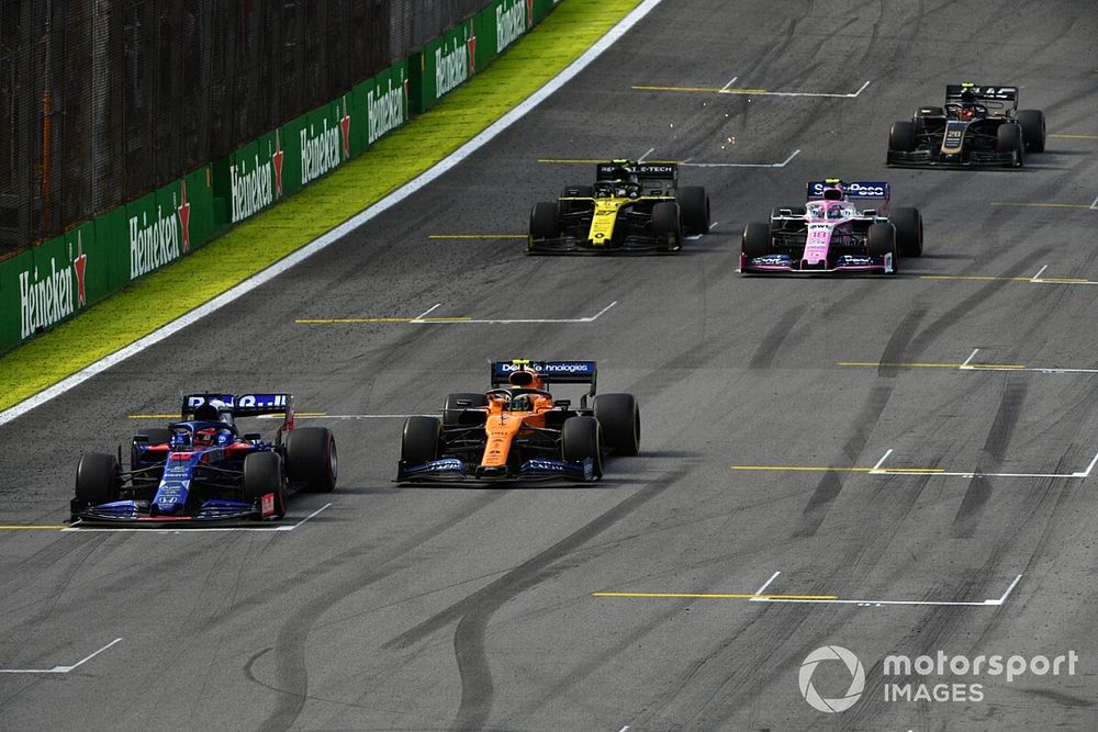 Daniil Kvyat, Toro Rosso STR14, leads Lando Norris, McLaren MCL34, Lance Stroll, Racing Point RP19, Nico Hulkenberg, Renault F1 Team R.S. 19, and Kevin Magnussen, Haas F1 Team VF-19
