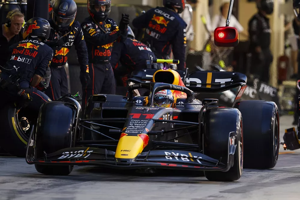 Sergio Perez, Red Bull Racing RB18, leaves his pit box after a stop
