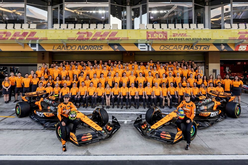 Lando Norris, McLaren F1 Team, Oscar Piastri, McLaren F1 Team, with McLaren team members