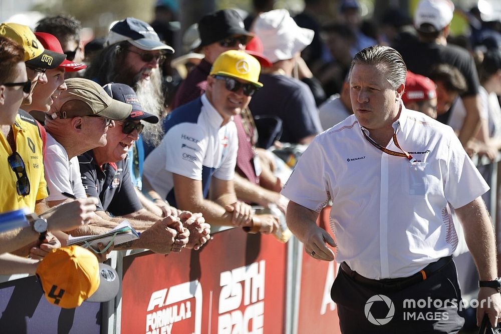 Zak Brown, Executive Director, McLaren signs autographs for fans.