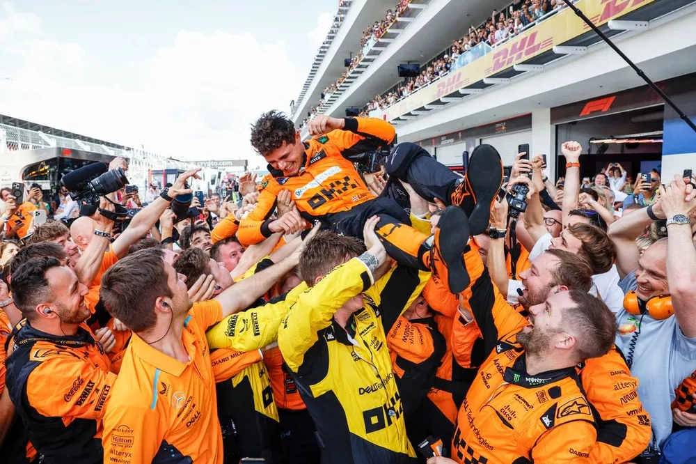 Lando Norris, McLaren F1 Team, 1st position, celebrates with his team on arrival in Parc Ferme
