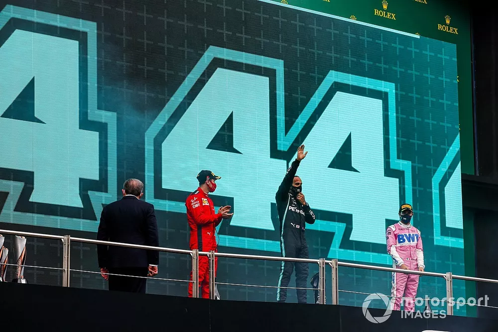 Sebastian Vettel, Ferrari, 3rd position, Lewis Hamilton, Mercedes-AMG F1, 1st position, and Sergio Perez, Racing Point, 2nd position, on the podium