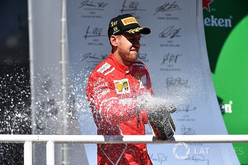 Podio: ganador de la carrera Sebastian Vettel, Ferrari