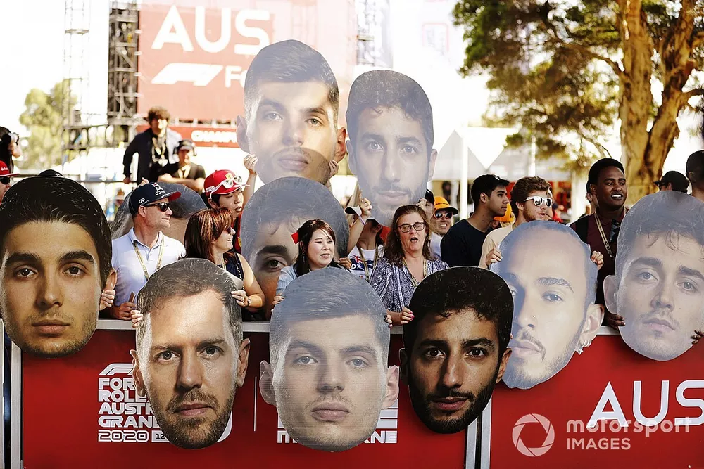 Fans greet the drivers with cardboard cutouts