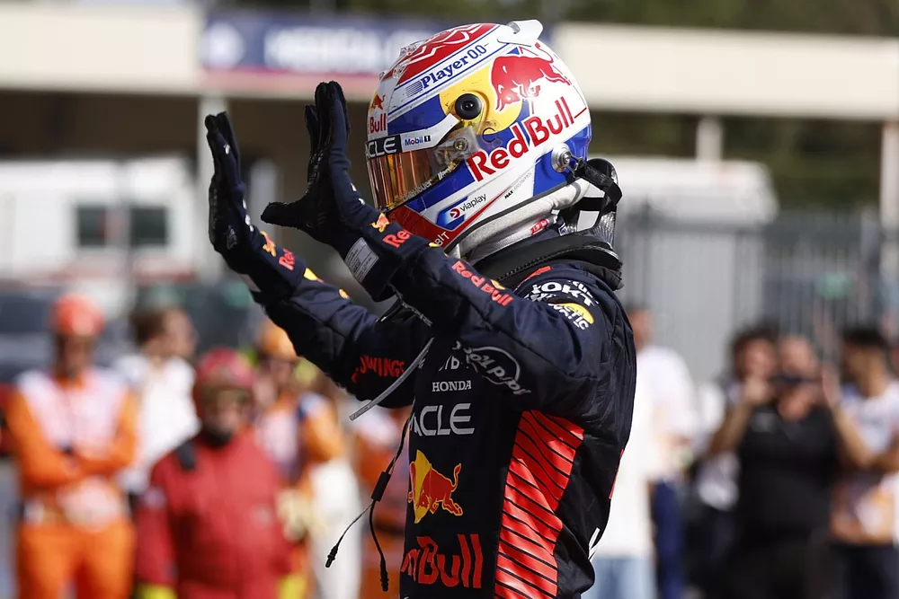Max Verstappen, Red Bull Racing, 1st position, celebrates his record 10th consecutive win on arrival in Parc Ferme