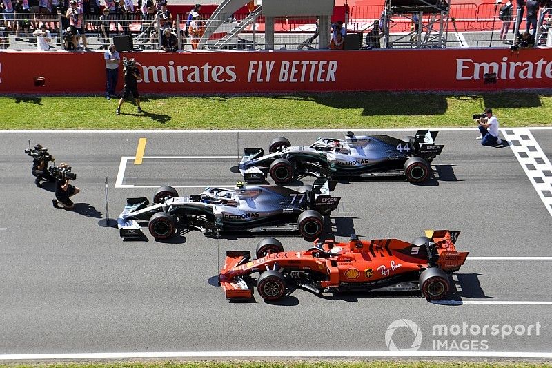 Top three Qualifiers Valtteri Bottas, Mercedes AMG W10, Lewis Hamilton, Mercedes AMG F1 W10, and Sebastian Vettel, Ferrari SF90, park on the grid after Qualifying