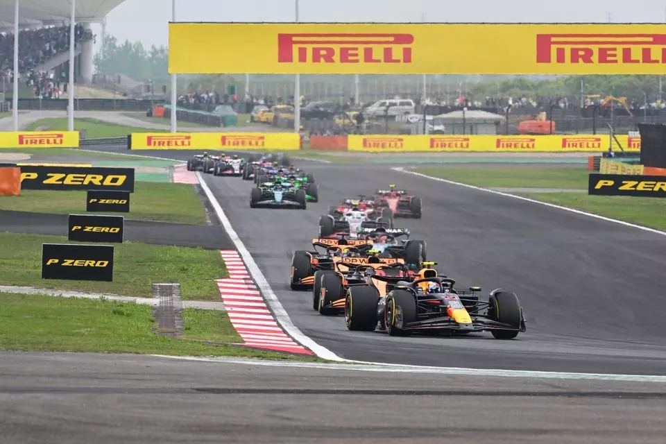 Sergio Perez, Red Bull Racing RB20 Lando Norris, McLaren MCL38