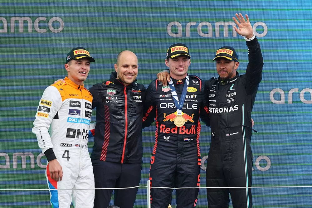 Lando Norris, McLaren, 2nd position, the Red Bull trophy delegate, Max Verstappen, Red Bull Racing, 1st position, Lewis Hamilton, Mercedes-AMG, 3rd position, on the podium