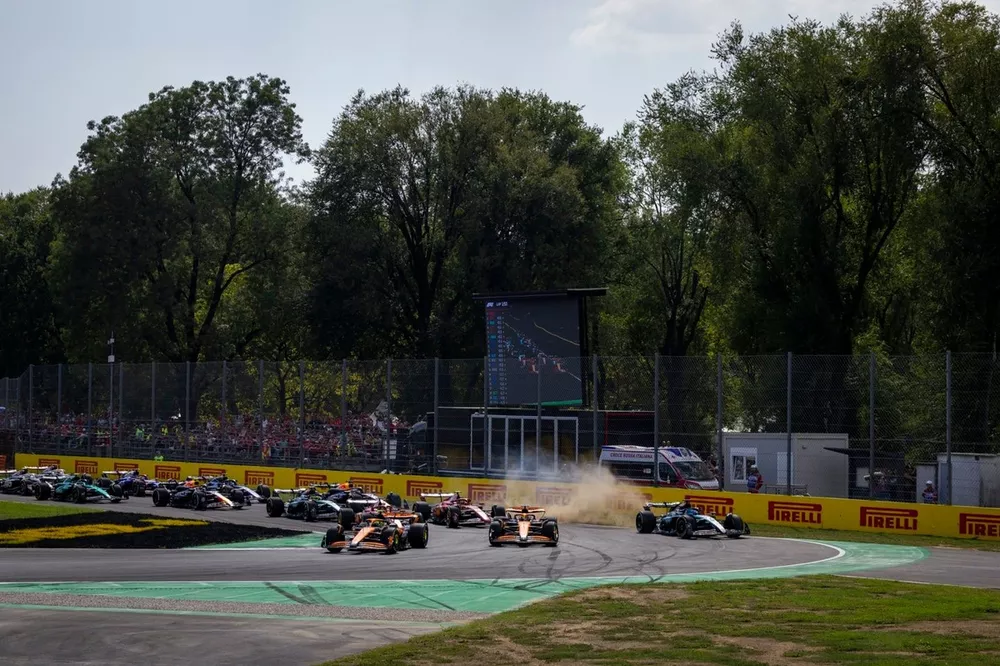 Lando Norris, McLaren MCL38, Oscar Piastri, McLaren MCL38, as George Russell, Mercedes F1 W15, runs straight