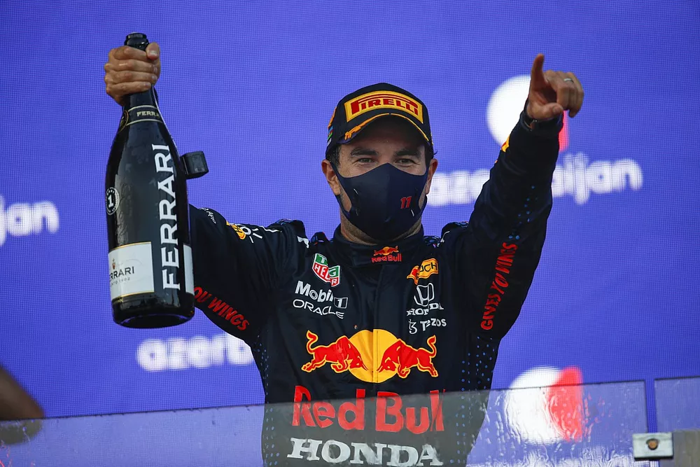 Sergio Perez, Red Bull Racing, 1st position, celebrates on the podium