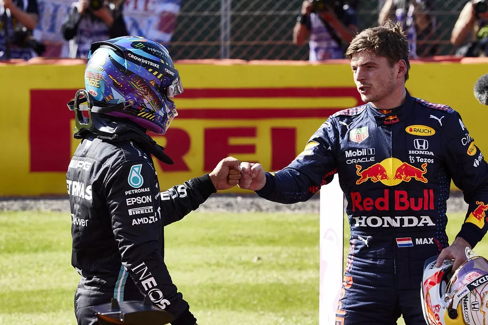 Lewis Hamilton, Mercedes, 2nd position, and Max Verstappen, Red Bull Racing, 1st position, congratulate each other 
