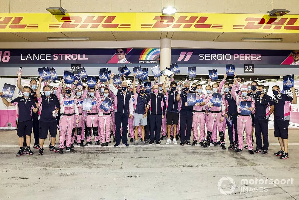 Sergio Perez, Racing Point, Lance Stroll, Racing Point, and Otmar Szafnauer, Team Principal and CEO, Racing Point gather with the rest of the team outside the garage