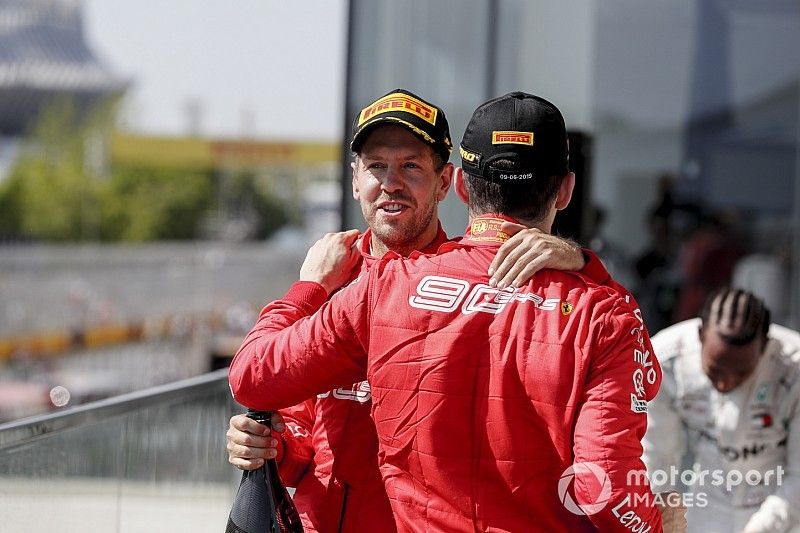 Sebastian Vettel, Ferrari, 2nd position, and Charles Leclerc, Ferrari, 3rd position, on the podium